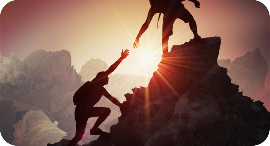 Traveler helping co-traveler to hit the top