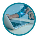 a man typing on a laptop