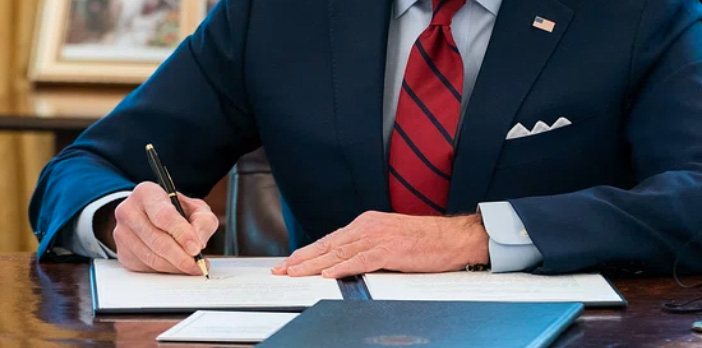 A man noting on a book