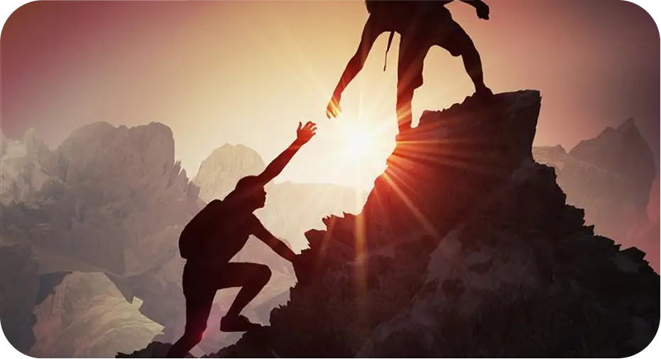 Traveler helping co-traveler to hit the top